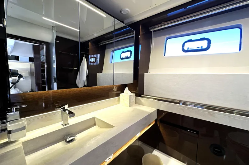 Slide: The Image of Luxurious bathroom interior of 2023 Prestige 590 yacht with modern fixtures and sleek design. - 77