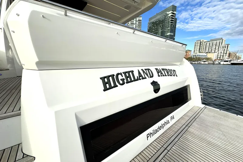 Slide: The Image of 2023 Prestige 590 yacht "Highland Patriot" docked in Philadelphia marina. - 8
