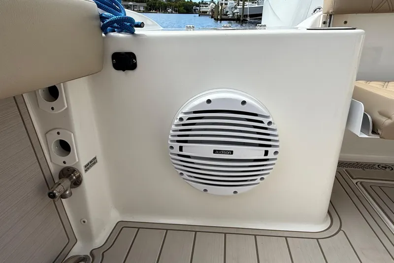 Slide: The Image of 2023 Sea Pro 320 DLX Offshore boat interior with Audison speaker and nautical features. - 15