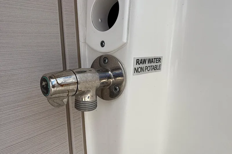 Slide: The Image of Raw water faucet labeled "non-potable" on 2023 Sea Pro 320 DLX Offshore boat. - 17