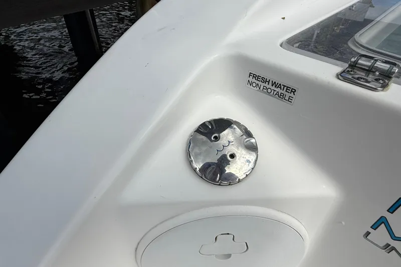 Slide: The Image of 2023 Sea Pro 320 DLX Offshore boat detail with non-potable fresh water label. - 20