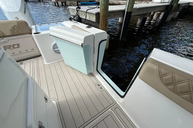 Slide: The Image of 2023 Sea Pro 320 DLX Offshore boat deck with seating and water view. - 29