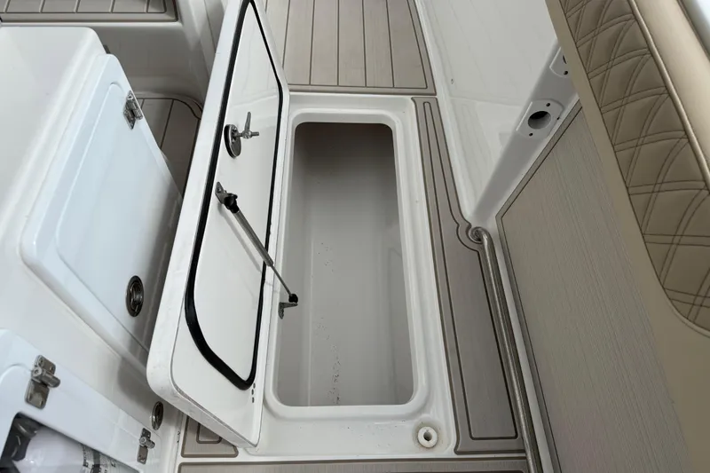 Slide: The Image of 2023 Sea Pro 320 DLX Offshore boat interior storage compartment with open hatch. - 32
