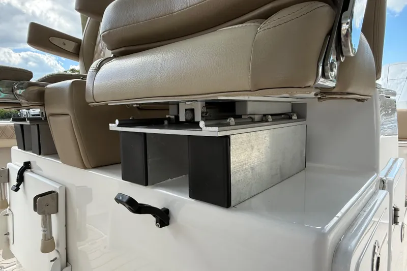 Slide: The Image of 2023 Sea Pro 320 DLX Offshore boat seating detail with storage compartments. - 36