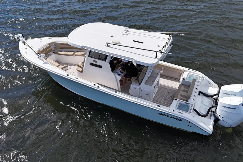 Slide: The Image of 2023 Sea Pro 320 DLX Offshore boat cruising on open water, aerial view. - 4
