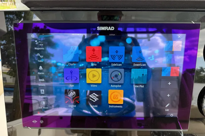 Slide: The Image of Simrad marine display on 2023 Sea Pro 320 DLX Offshore boat, showing navigation and sonar options. - 41