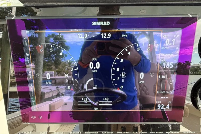 Slide: The Image of Simrad display on 2023 Sea Pro 320 DLX Offshore boat, showing navigation and engine data. - 42