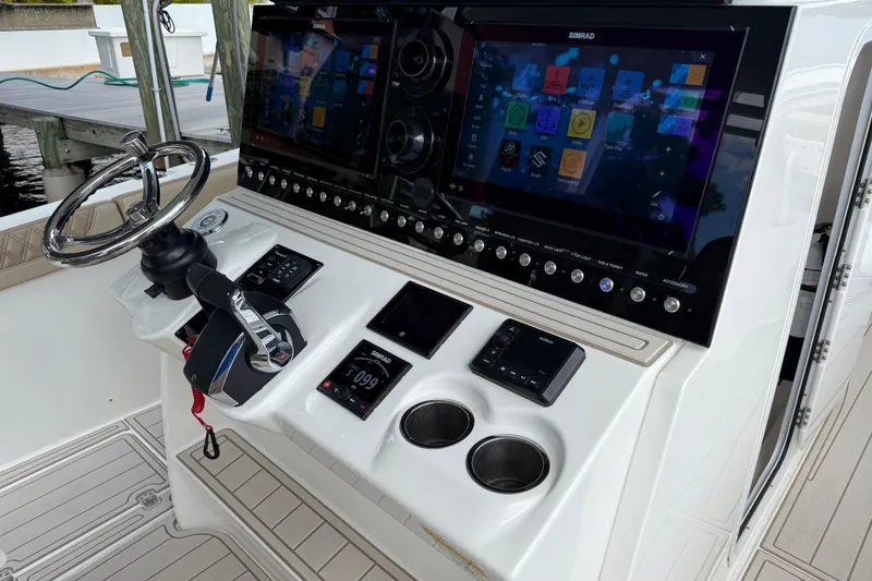 Slide: The Image of 2023 Sea Pro 320 DLX Offshore boat dashboard with advanced navigation and control systems. - 47