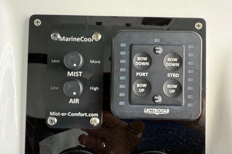 Slide: The Image of Control panel of a 2023 Sea Pro 320 DLX Offshore boat with mist and trim tab settings. - 51