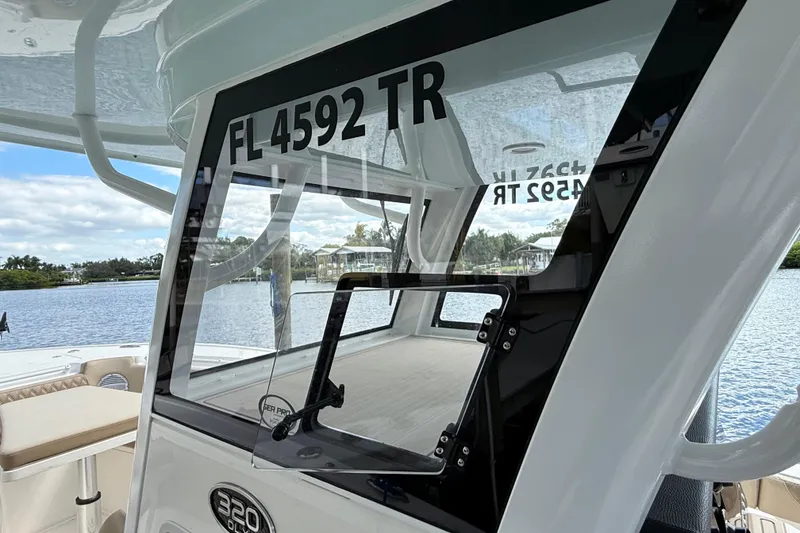 Slide: The Image of 2023 Sea Pro 320 DLX Offshore boat with registration FL 4592 TR on a sunny day. - 58