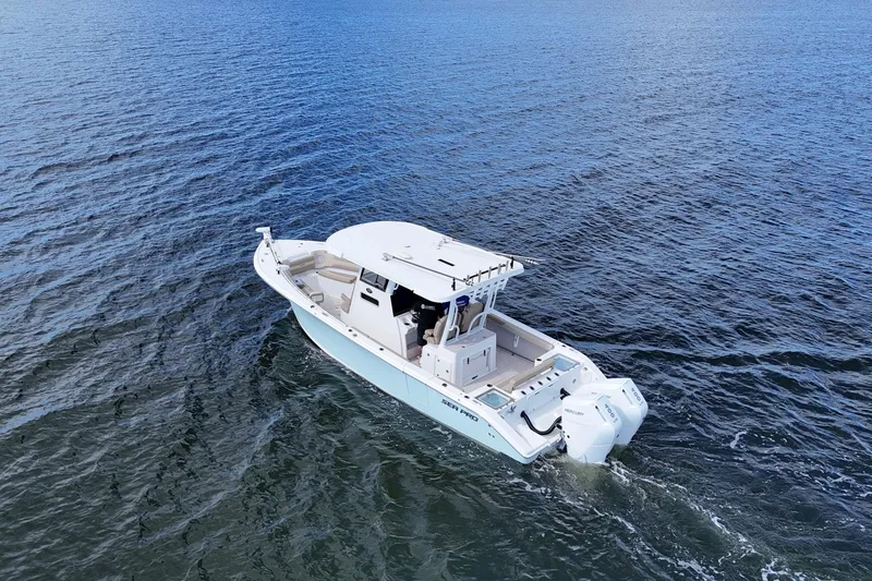 Slide: The Image of 2023 Sea Pro 320 DLX Offshore boat cruising on open water. - 7