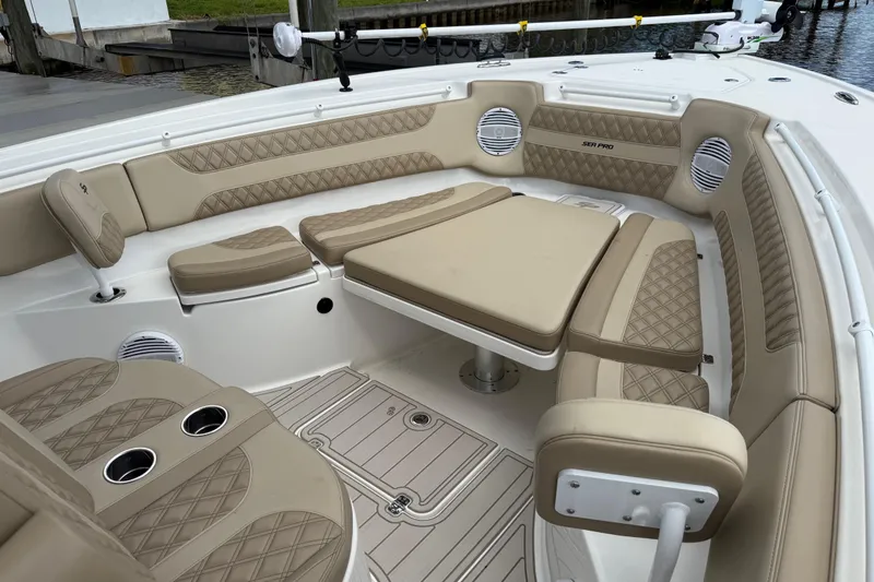 Slide: The Image of Luxurious seating area on 2023 Sea Pro 320 DLX Offshore boat with beige upholstery. - 80