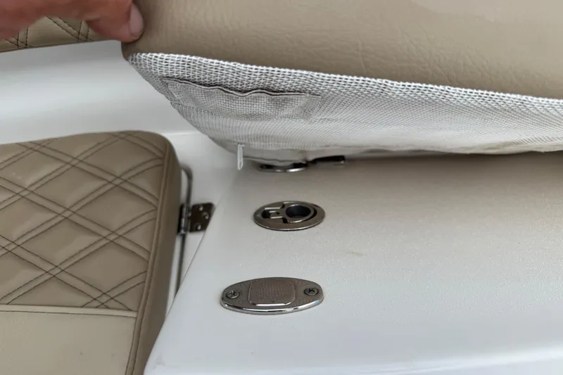 Slide: The Image of 2023 Sea Pro 320 DLX Offshore boat interior detail with beige upholstery and metal fixtures. - 86