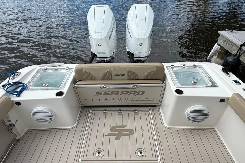 Slide: The Image of 2023 Sea Pro 320 DLX Offshore boat with dual engines and spacious deck. - 9