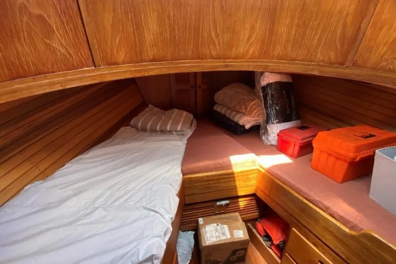 Slide: The Image of Cozy cabin interior of 1988 Dudley Dix Echo 38 sailboat with wooden finish and storage. - 10