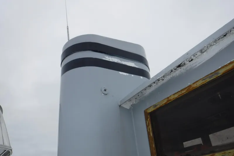 Slide: The Image of Chimney detail of 1988 Dudley Dix Echo 38 boat against cloudy sky. - 12