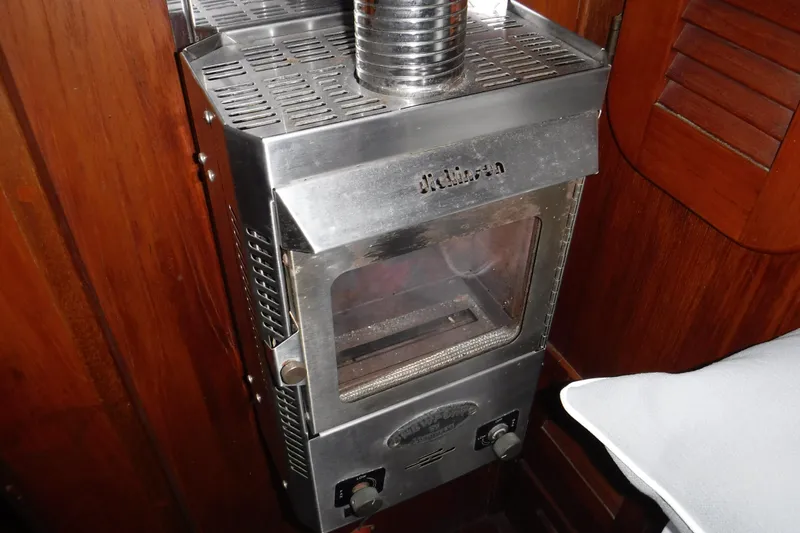 Slide: The Image of Stainless steel stove inside 1988 Dudley Dix Echo 38 yacht, featuring wooden interior. - 14
