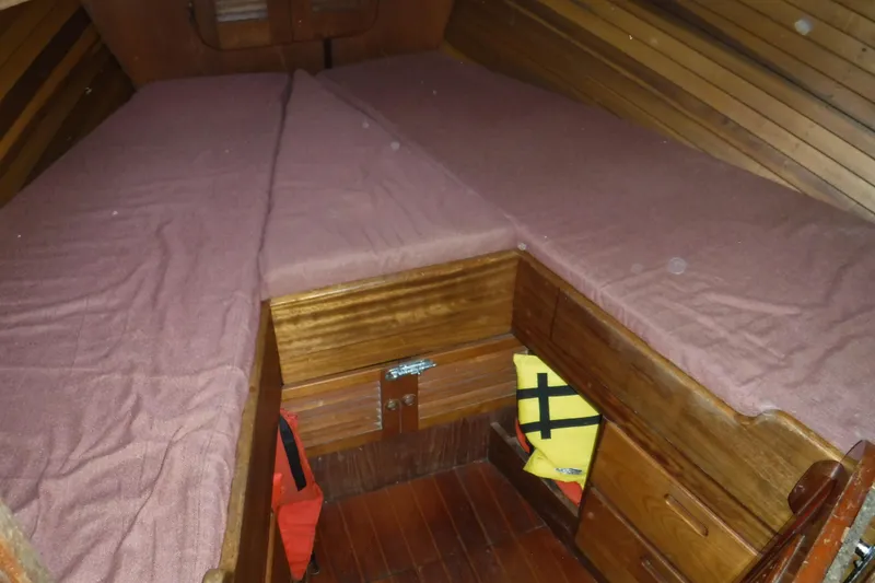 Slide: The Image of Cozy cabin interior of 1988 Dudley Dix Echo 38 sailboat with wooden finish and storage. - 17