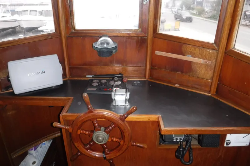 Slide: The Image of Helm of 1986 Dudley Dix Echo 38 with Garmin GPS and wooden steering wheel. - 2