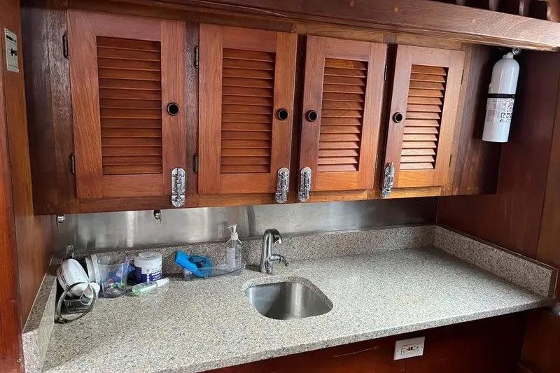 Slide: The Image of Wooden cabinets and granite countertop in 1988 Dudley Dix Echo 38 boat kitchen. - 6