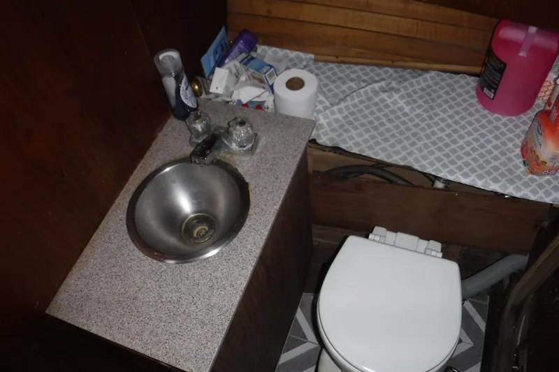 Slide: The Image of Small bathroom in 1986 Dudley Dix Echo 38 boat with sink and toilet. - 7