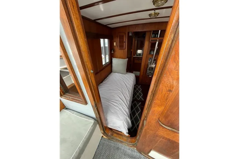 Slide: The Image of Cozy cabin interior of 1988 Dudley Dix Echo 38 sailboat with wooden finish and bed. - 8