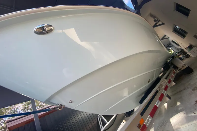 Slide: The Image of 2006 Everglades 290 Center Console boat on trailer in garage setting. - 13