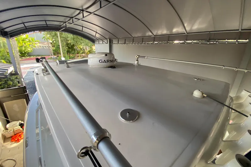 Slide: The Image of 2006 Everglades 290 Center Console boat under canopy with Garmin equipment visible. - 20