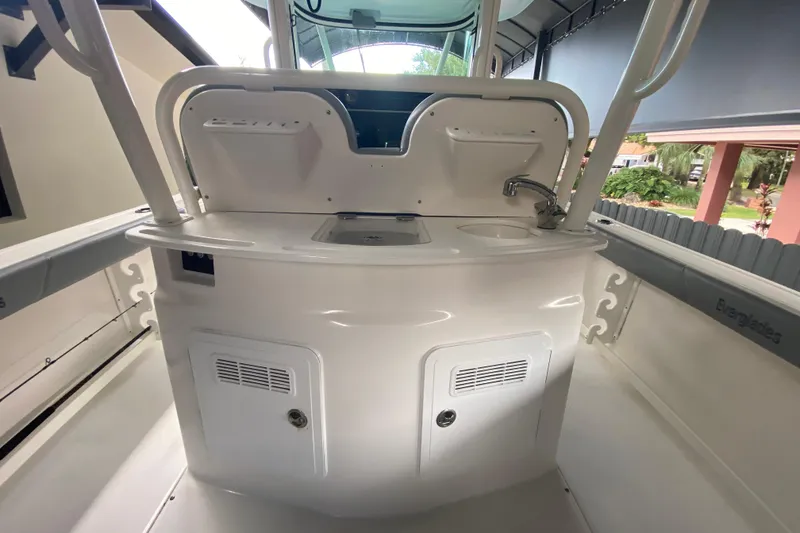 Slide: The Image of 2006 Everglades 290 Center Console boat interior with sink and storage compartments. - 28