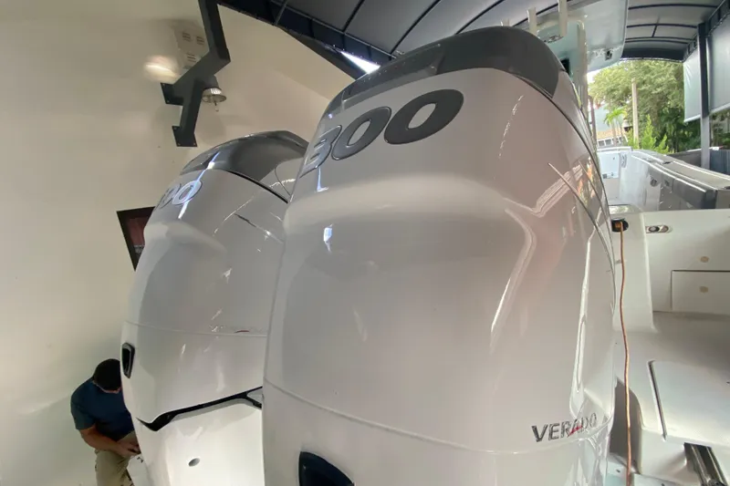 Slide: The Image of 2006 Everglades 290 Center Console with twin Verado engines in a showroom. - 33