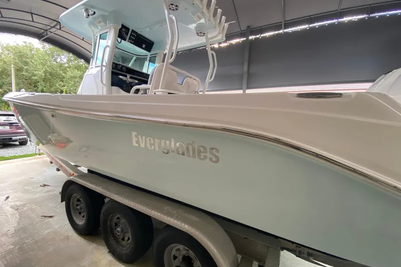 Slide: The Image of 2006 Everglades 290 Center Console boat on trailer in covered storage. - 35