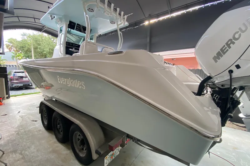 Slide: The Image of 2006 Everglades 290 Center Console boat on trailer with Mercury outboard engines. - 37