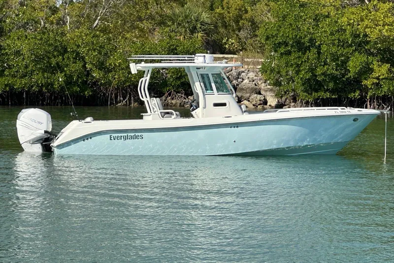 Slide: The Image of 2006 Everglades 290 Center Console boat on calm water near mangroves. - 5