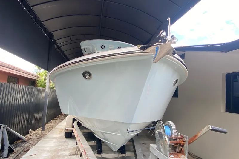 Slide: The Image of 2006 Everglades 290 Center Console boat on trailer under canopy. - 9