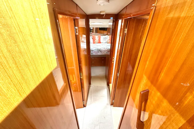 Slide: The Image of Interior of 2005 Riviera 47 Open Flybridge with wood finish, microwave, and scenic window view. - 11