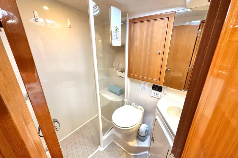 Slide: The Image of Luxurious wooden interior hallway of 2005 Riviera 47 Open Flybridge yacht. - 14
