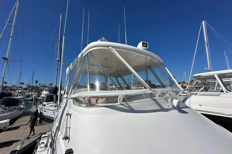 Slide: The Image of 2005 Riviera 47 Open Flybridge interior with fishing rod storage compartment. - 22