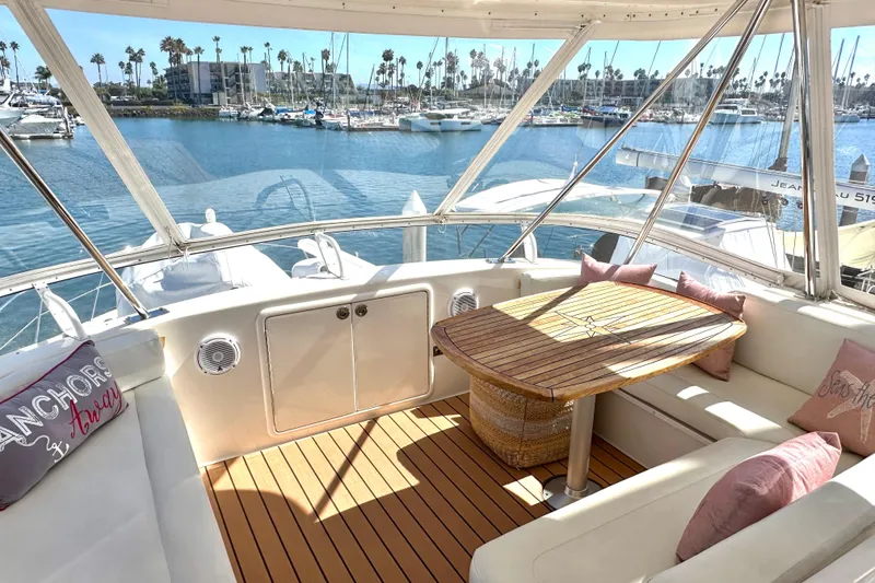 Slide: The Image of Helm of 2005 Riviera 47 Open Flybridge with modern navigation equipment and controls. - 27