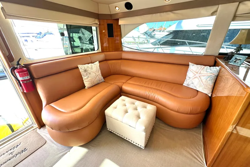 Slide: The Image of Luxurious interior of 2005 Riviera 47 Open Flybridge yacht with leather seating and wood accents. - 5