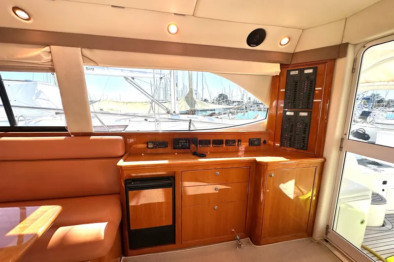 Slide: The Image of Luxurious 2005 Riviera 47 Open Flybridge interior with leather seating and elegant wood finishes. - 6