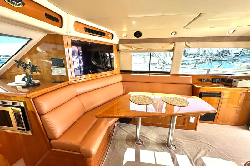 Slide: The Image of Luxurious interior of 2005 Riviera 47 Open Flybridge yacht with leather seating and modern amenities. - 7