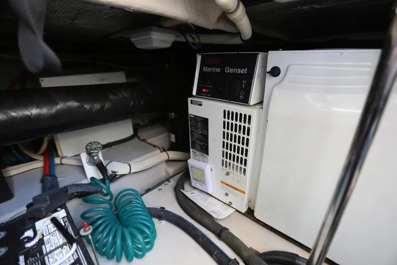 Slide: The Image of Engine room of 2004 Sea Ray 420 Sedan Bridge with Onan Marine Genset. - 102