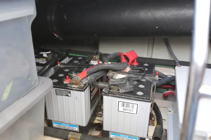 Slide: The Image of Batteries in the engine compartment of a 2004 Sea Ray 420 Sedan Bridge boat. - 105
