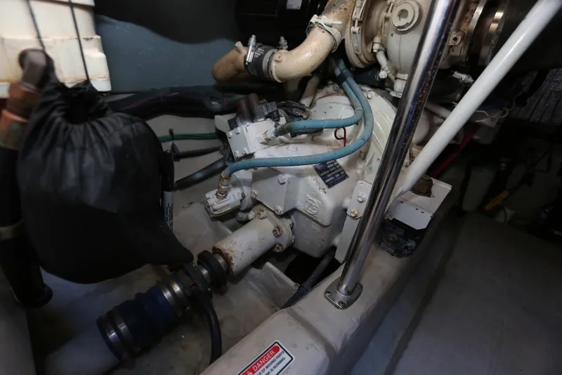 Slide: The Image of Engine room of 2004 Sea Ray 420 Sedan Bridge, showcasing mechanical components. - 110