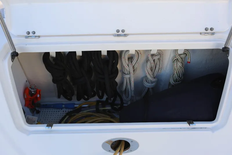Slide: The Image of Storage compartment with ropes on a 2004 Sea Ray 420 Sedan Bridge boat. - 15