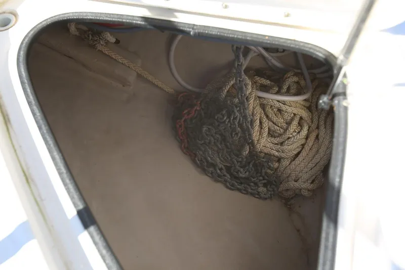 Slide: The Image of Storage compartment with ropes and chains on a 2004 Sea Ray 420 Sedan Bridge. - 27