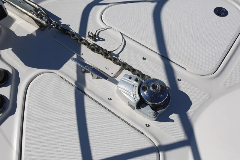 Slide: The Image of Anchor windlass on 2004 Sea Ray 420 Sedan Bridge yacht deck. - 28