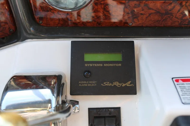 Slide: The Image of Control panel of 2004 Sea Ray 420 Sedan Bridge with systems monitor display. - 44