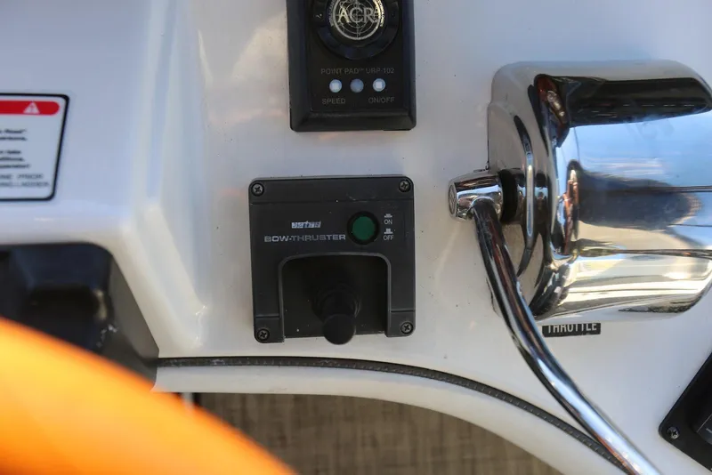 Slide: The Image of Control panel of a 2004 Sea Ray 420 Sedan Bridge with bow thruster and throttle. - 45