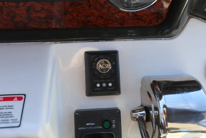 Slide: The Image of Control panel of a 2004 Sea Ray 420 Sedan Bridge boat. - 46